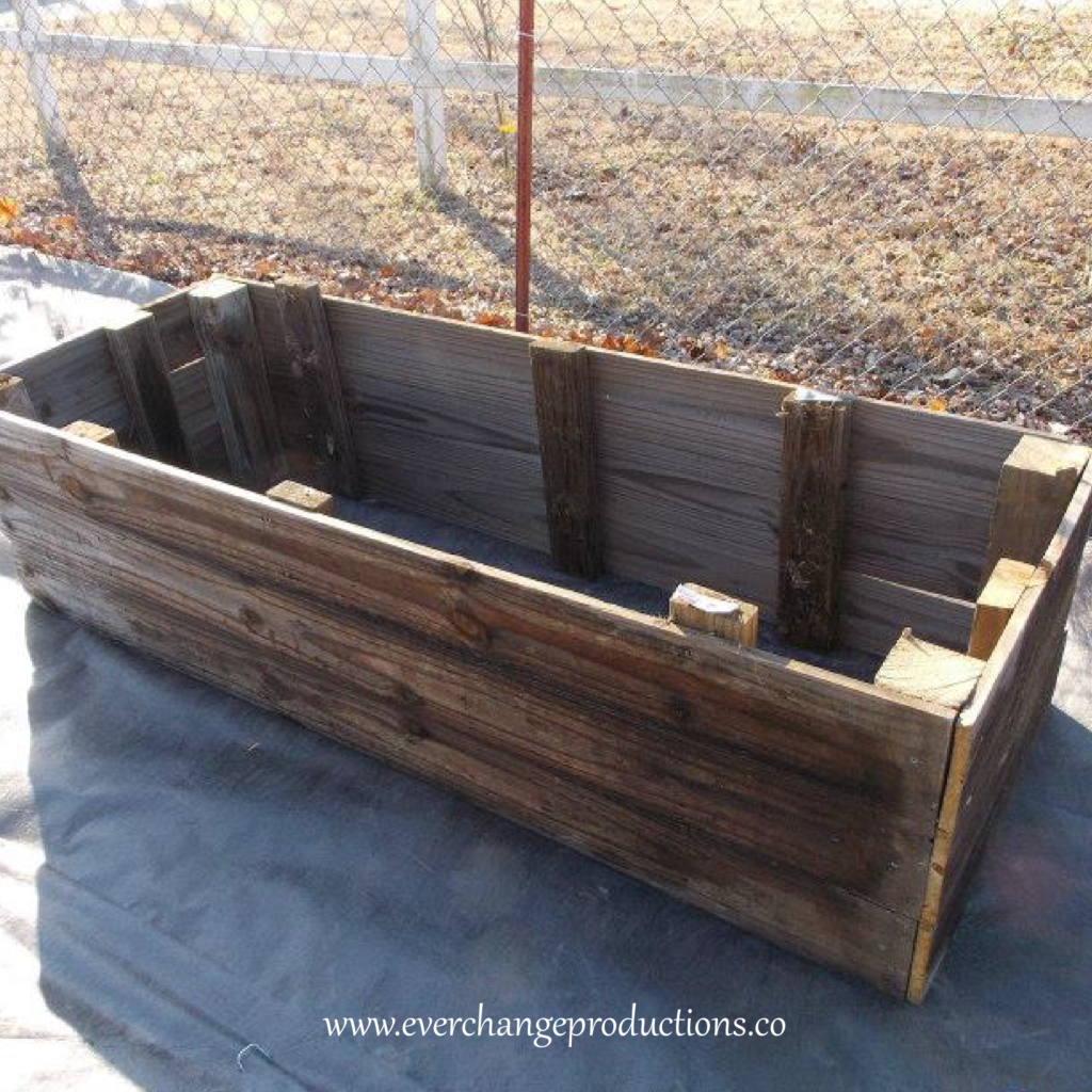 These raised beds are made from old fence wood. Start your garden with whatever you have lying around!