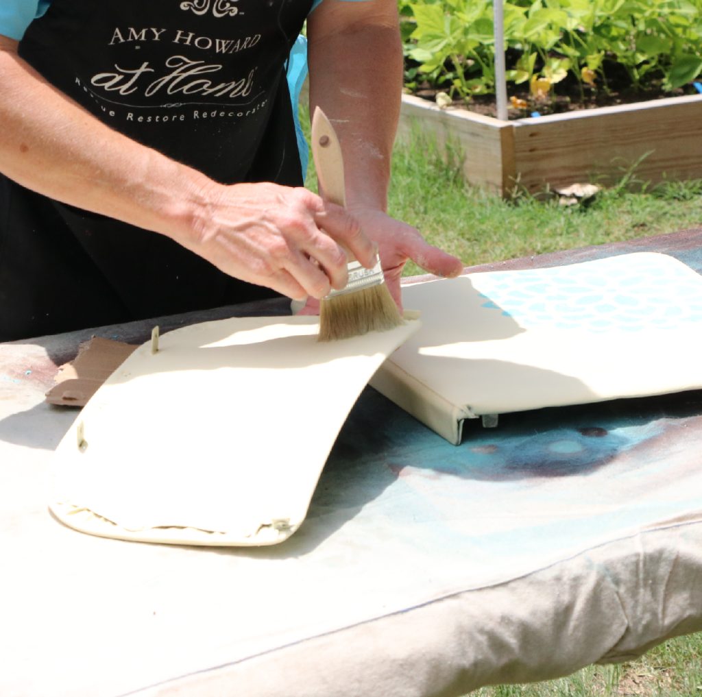 Step 4: Paint in layers Now, with long, clean strokes start to cover the fabric. You'll be able to see the color of the chair through the color of the paint, so you'll need to do multiple layers that go perpendicular to each other. This criss-cross method makes the lines look more like fabric instead of paint.
