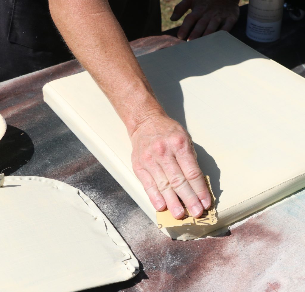 Shake your spray lacquer then start at the top of the chair and work your way down with long clean strokes. Do as many coats as it needs to have even coverage, sand lightly between each layer and wipe with a damp cloth. Then finish it off with a coat of clear lacquer.