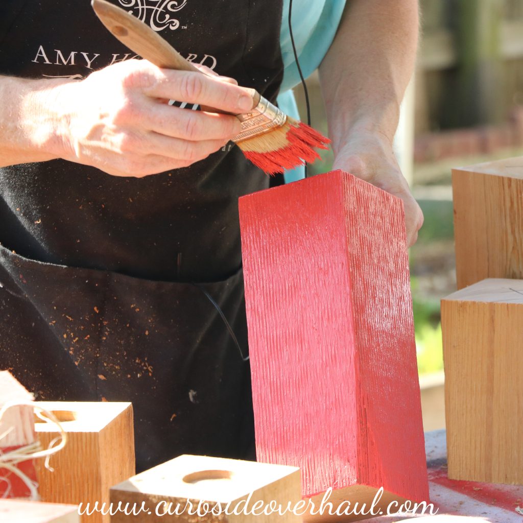 Step Two: Paint Your Blocks  Paint your blocks to fit your home decor. We used white and red for ours, but this is another project that can used all year round, so feel free to use other colors that might suite your home better. You can choose solid colored blocks, but we decided to do stripes like a candy cane.