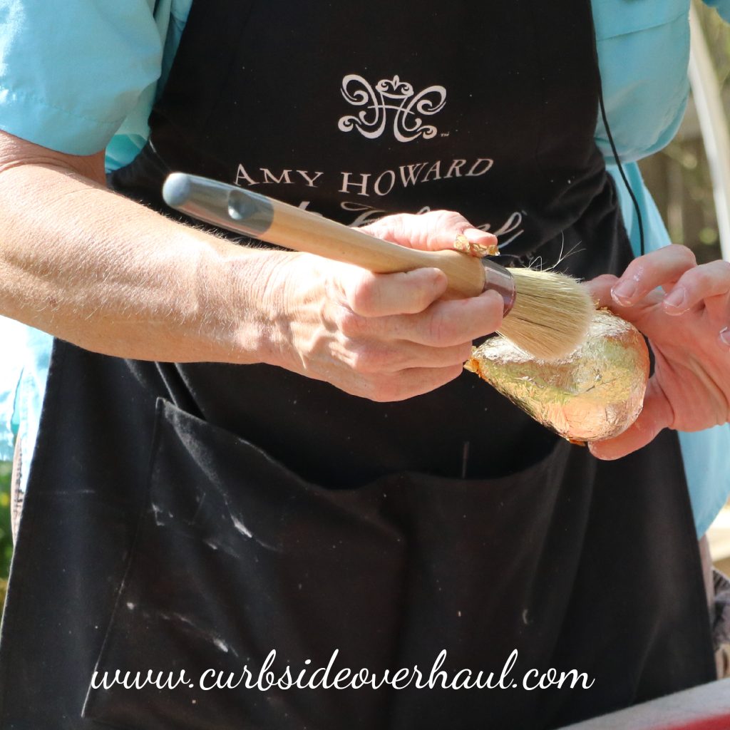 Step Three: Brush  Once the pear is cover with the leaf, take a brush and lightly brush off the excess flakes.