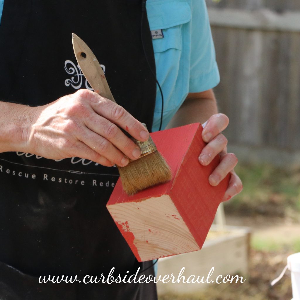 Step Six: Add Light Antique Wax  Once your one-step paint has dried, you can brush on the wax.  Coat your brush in the light wax and then offload the brush on a piece of cardboard.  Offloading will get rid of clumps of wax and ensure the wax comes of your brush evenly.  Brush you Light Antique Wax onto your piece with quick, light brush strokes in all different directions. 