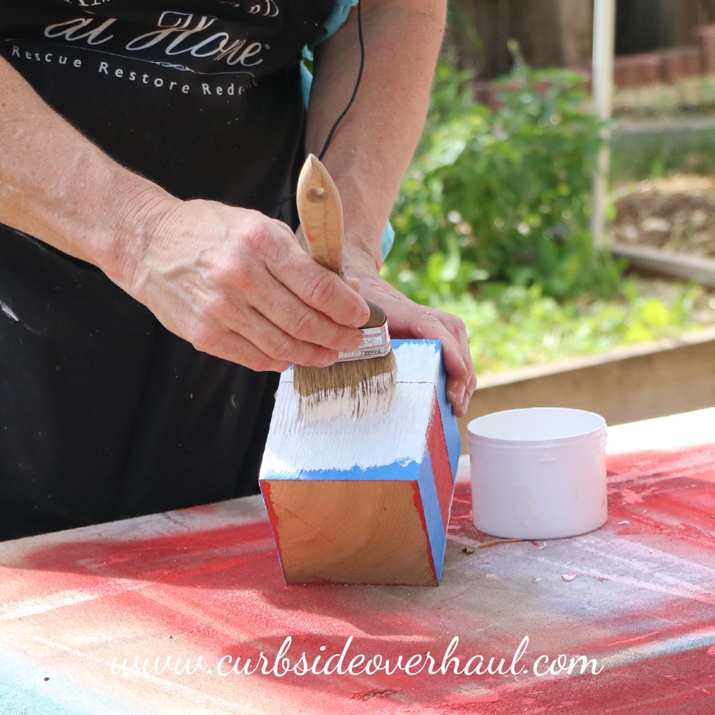 Step Four: Paint  Sometimes, paint tends to spread where it's not supposed to. It can get under the tape, but one way to avoid this is to start your brushstrokes on the tape and then onto the surface to be painted. This keeps you from pushing the paint under the tape causing that rough line. Then pull the tape as soon as the paint is dry to the touch.