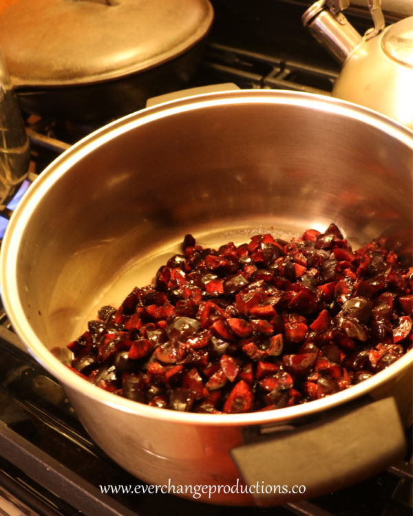 In 6-8 quart sauce pan mix in the sugar, pectin, lemon and almond extract. Then add the cherries.