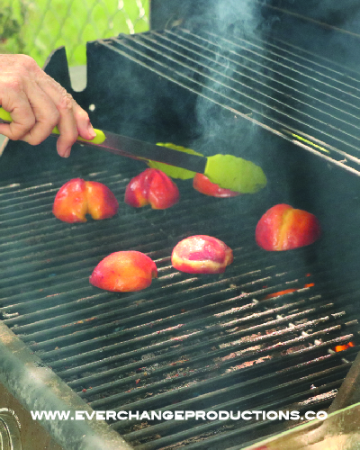 Baste peach halves with syrup and put on grill, cut side down