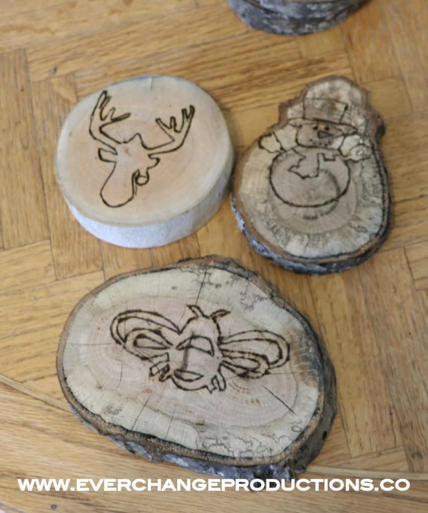  Step Three- Take your wood burning tool and just follow the lines. You can use the tool to do some shading if you like to enhance the motifs even further. Your design can be as simple or complex as you want. Make sure you have a couple of extra wood slices to practice.