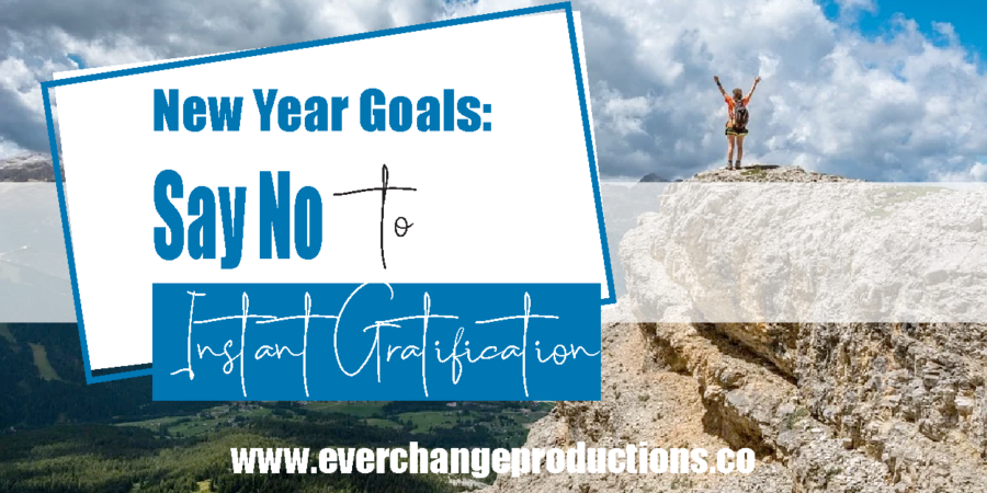 accomplished person on top of mountain with words that say New Year Goals: Say No to Instant Gratification